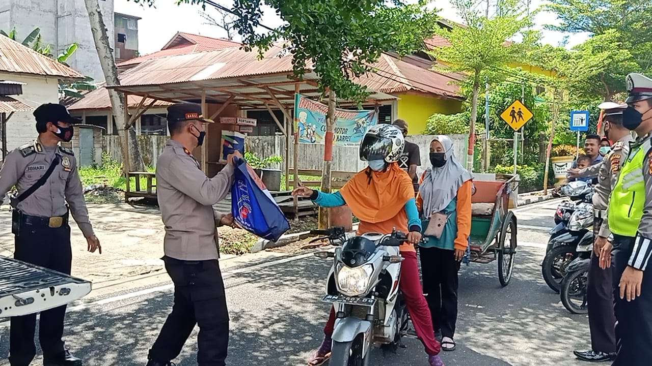 Kapolsek Bangko Pimpin Giat Himbauan Prokes di Pasar Datuk Rubiah